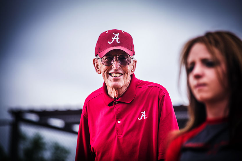 Alabama ASA Hall of Fame member coaches a girls softball player taken by a Tuscaloosa Photographer.
