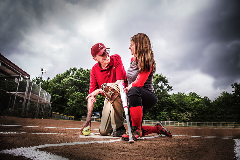 Tuscaloosa, Alabama softball coach Paul Morrison with one of the girls softball players he coached.  Taken by a Tuscaloosa photographer..