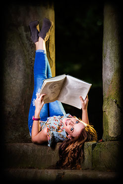 Tuscaloosa photographers senior picture of a Sipsey Valley High School Senior at Capitol Park in Tusdcaloosa, Alabama upside down looking at art